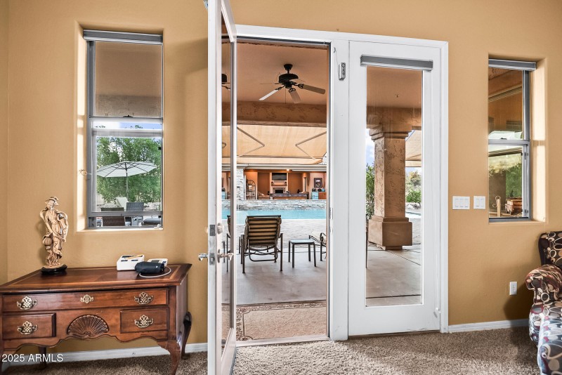 DOORS TO BACK PATIO FROM PRIMARY BEDROOM