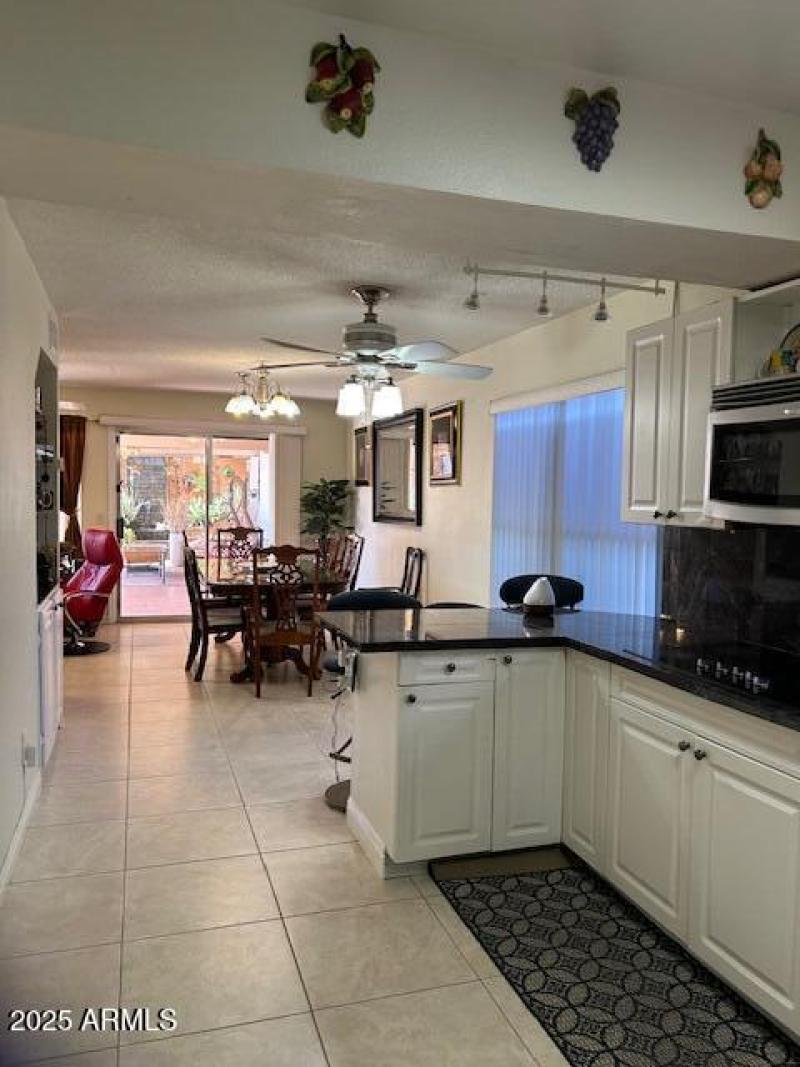 Kitchen view to dining area and slider t