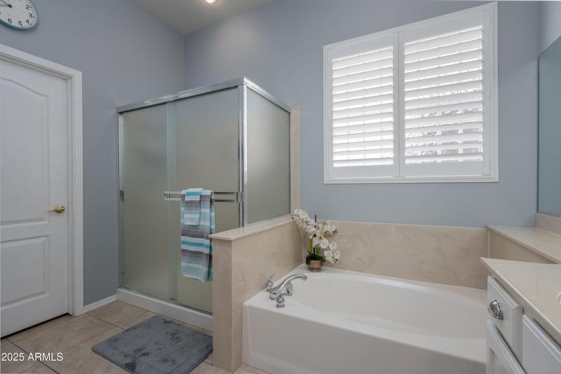 Primary bathroom w separate tub & shower