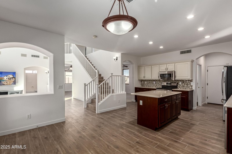 Dining facing grand room and kitchen.
