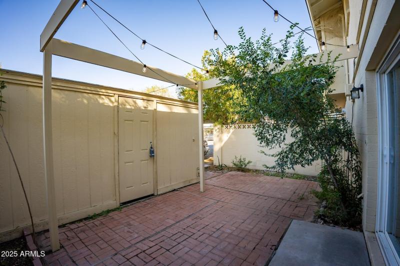 Private fenced Patio with Storage Shed