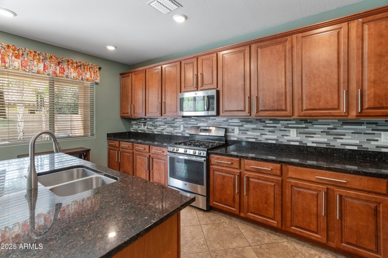 Tiled backsplash and granite counters