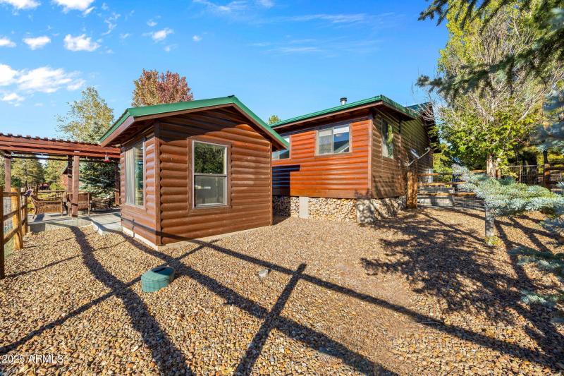 SIDE YARD SHOT OF HOUSE AND SHED