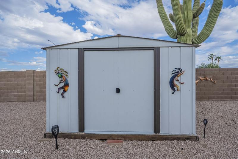 Shed in backyard-conveys