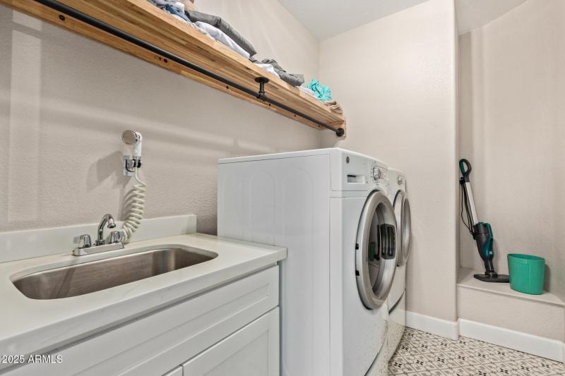 Downstairs laundry room is large