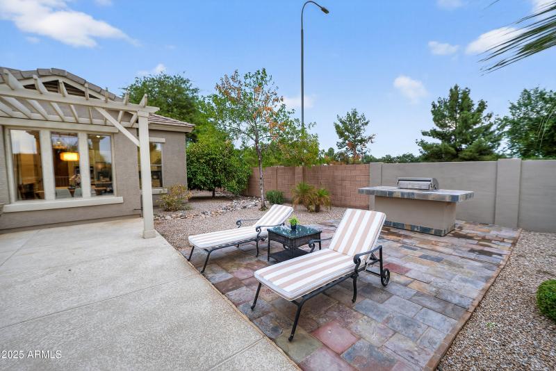 backyard lounge area and built in bbq