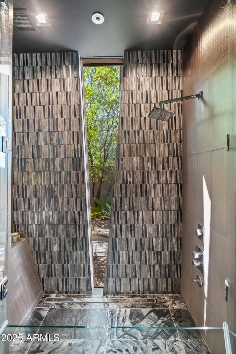 custom glass-enclosed shower and bath