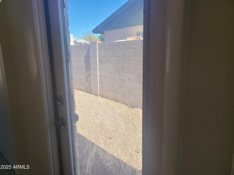 Door to yard from bathroom