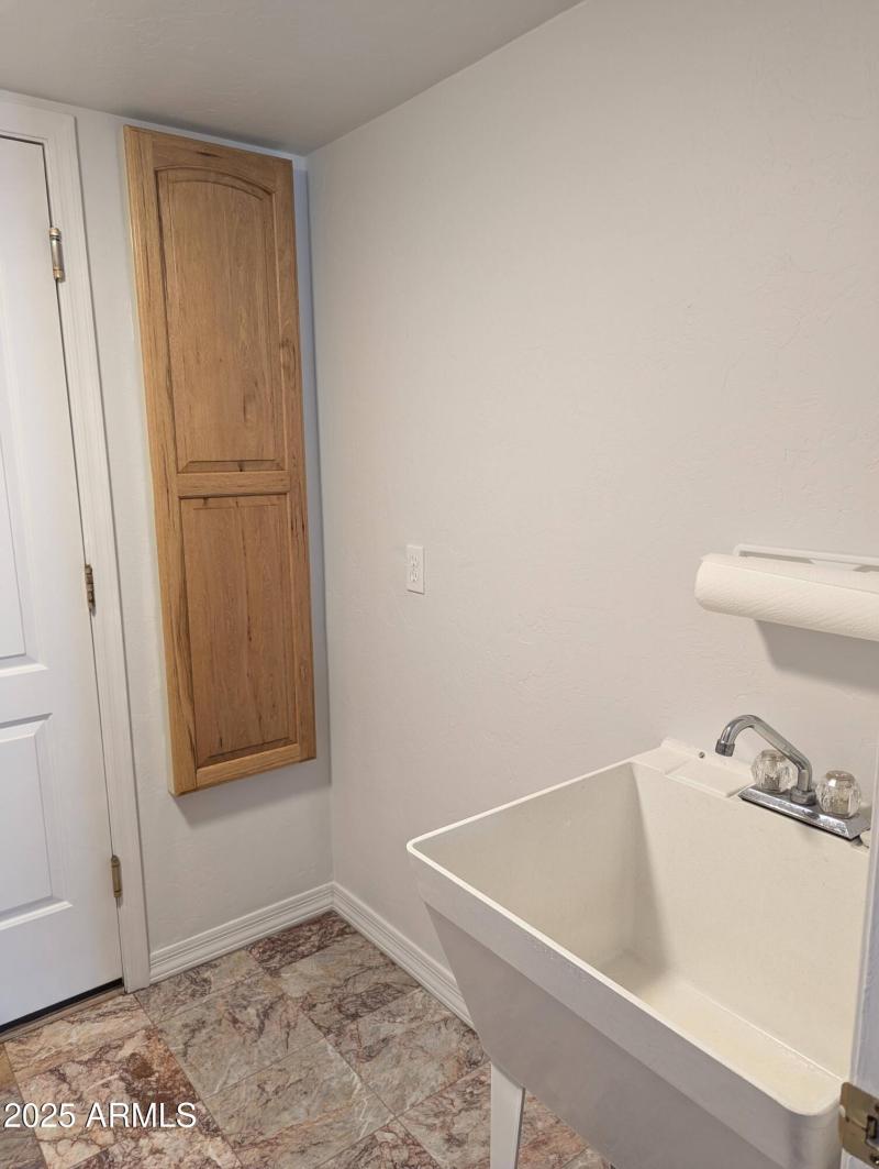 Sink and built-in ironing board