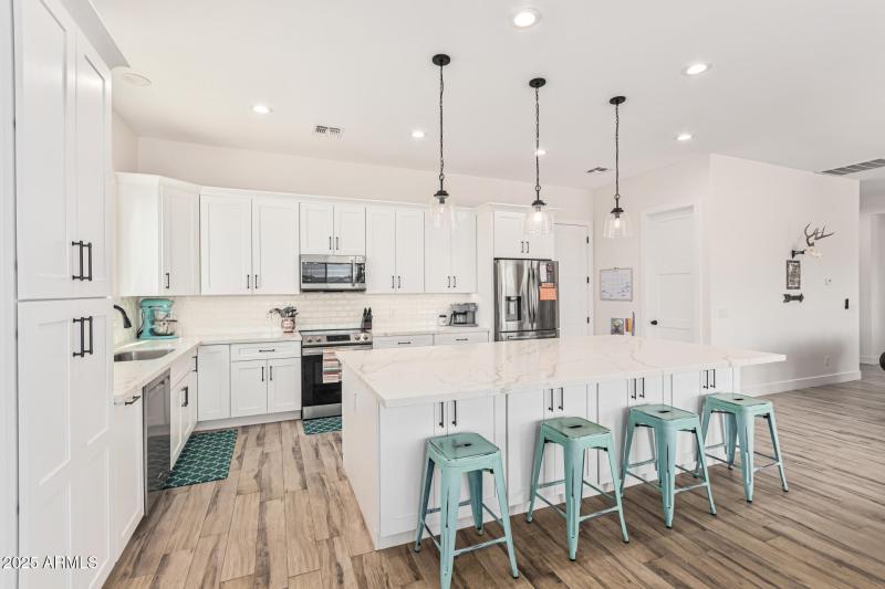 massive island and shaker cabinets