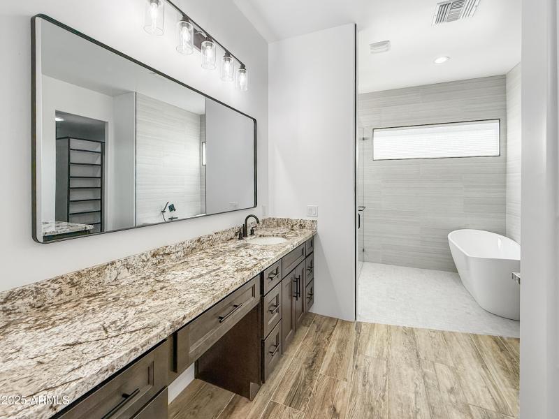 Expansive Dual Vanity w/ Granite Tops