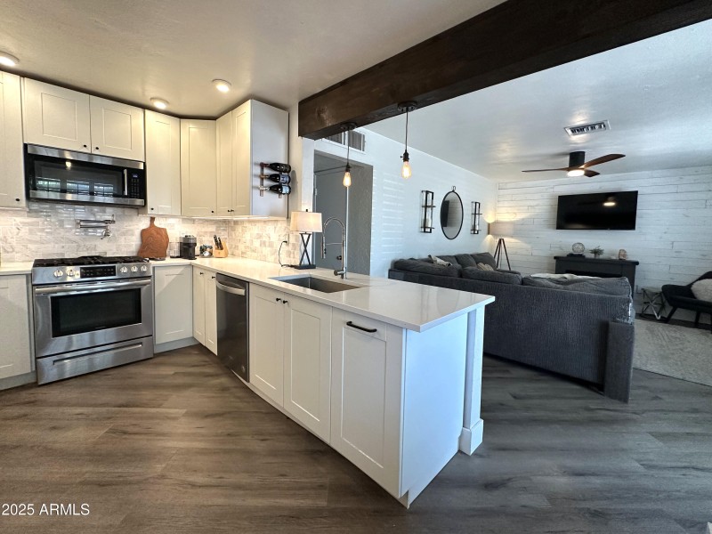 Kitchen with view of living room