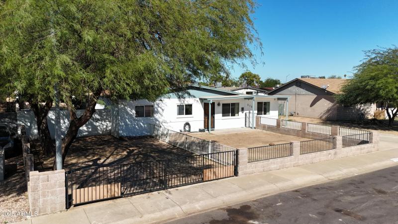RV parking under tree with gate