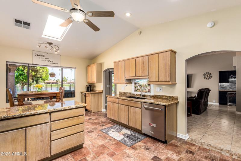 Kitchen with partial Family room view