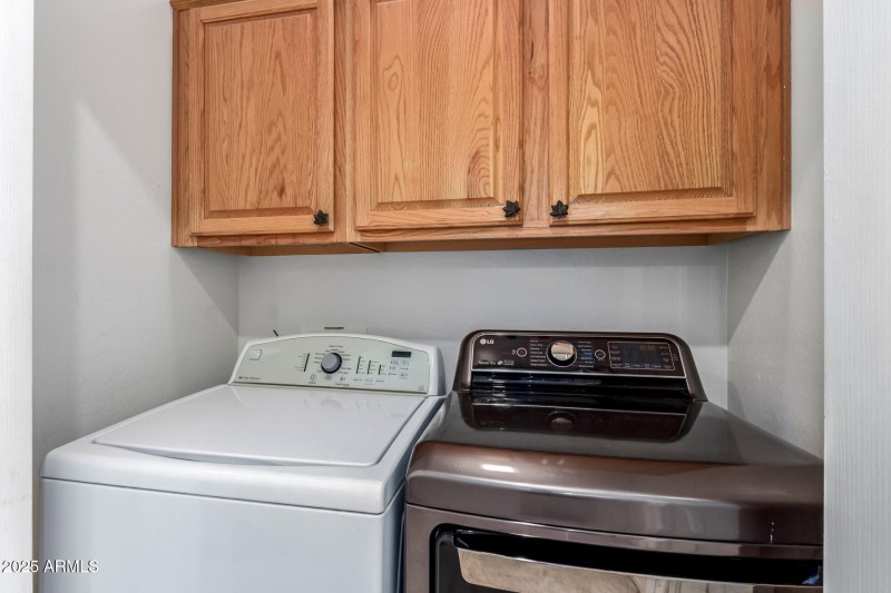 Laundry Area with Cabinets