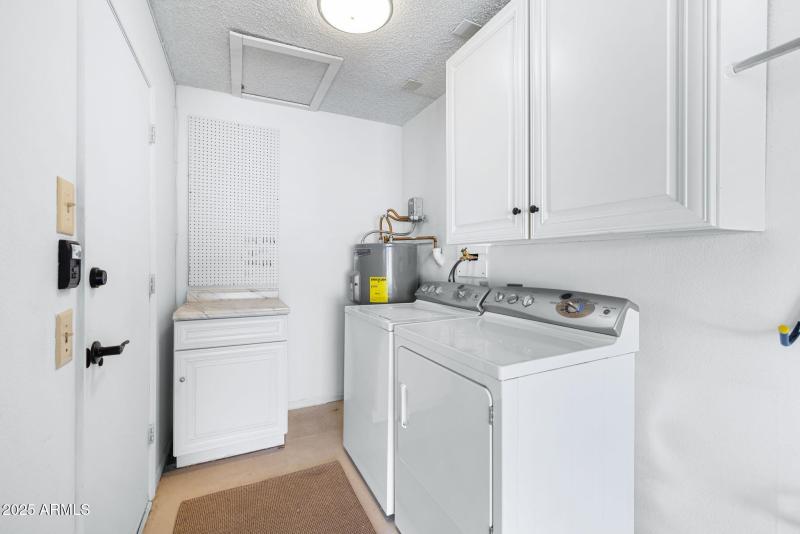 Laundry w upper white cabinets & matchin