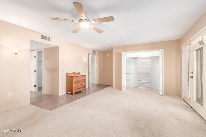 Entrance to bathroom & closets on left
