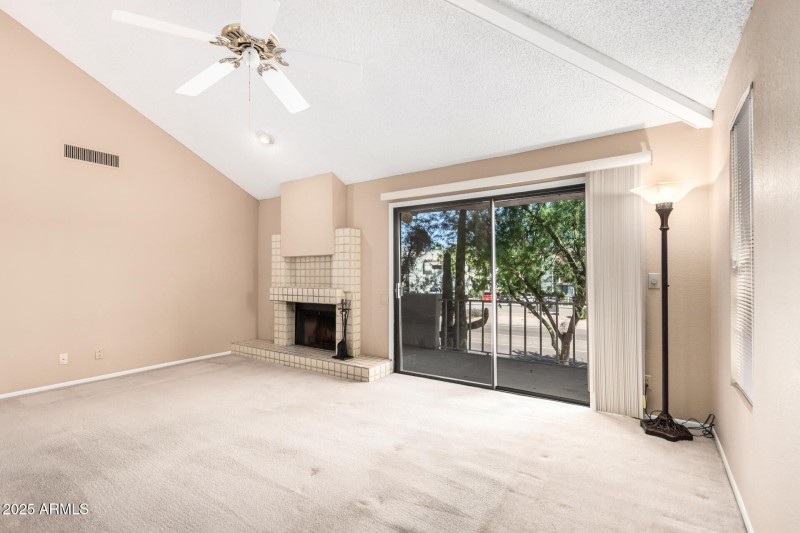 living room fireplace and balcony