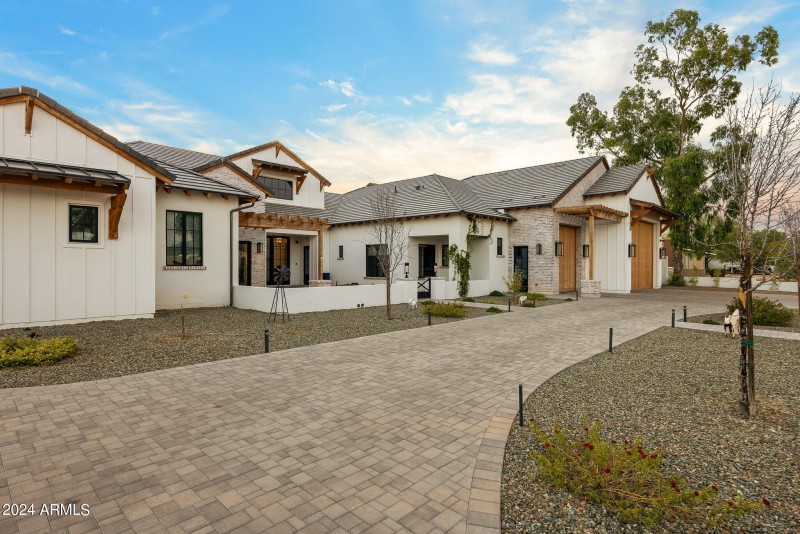 83oversized driveway entrance at sunset