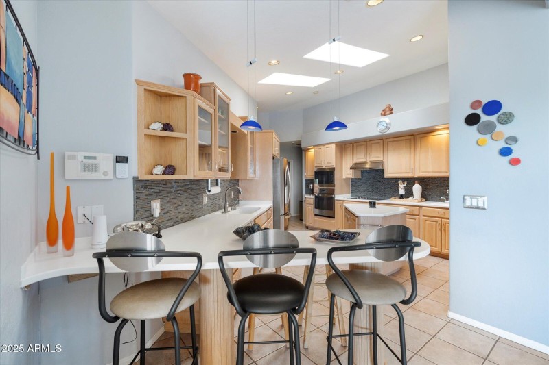 Kitchen view framed by breakfast bar