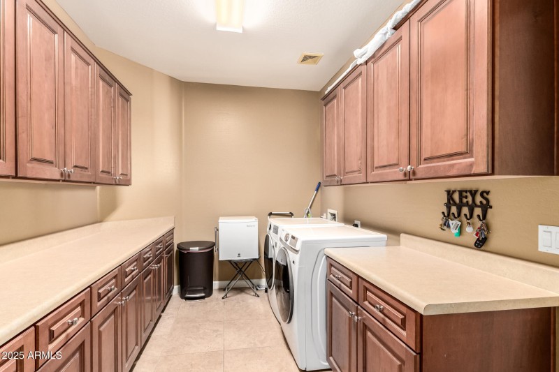 Lots of cabinets in this laundry room