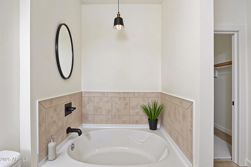 PRIMARY BATH TUB DIGITALLY STAGED