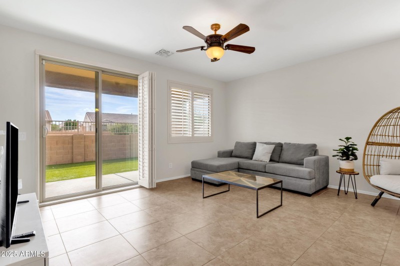 Living room w/ slider to backyard