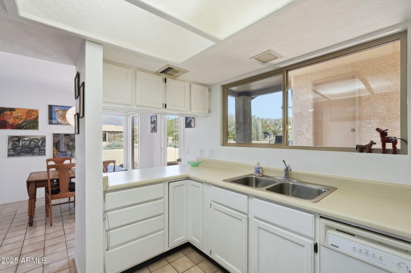 Open kitchen overlooks dining area