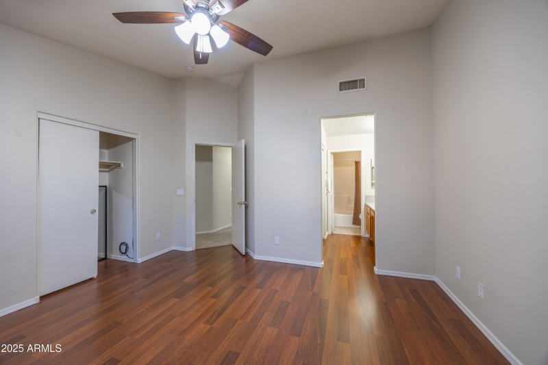View from primary bedroom to bath