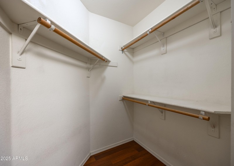 Walk-in closet in primary bedroom