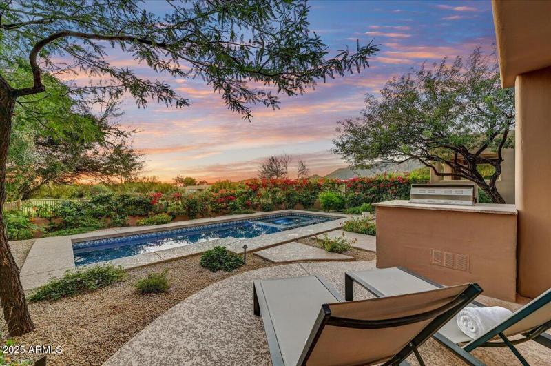 Pool Sunning Area with Lush Landscaping