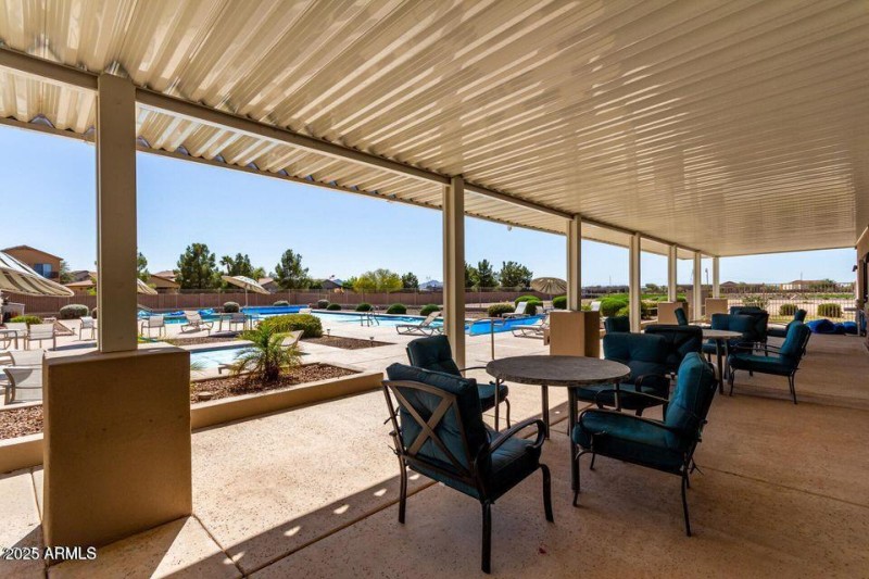 Covered seating area by pool