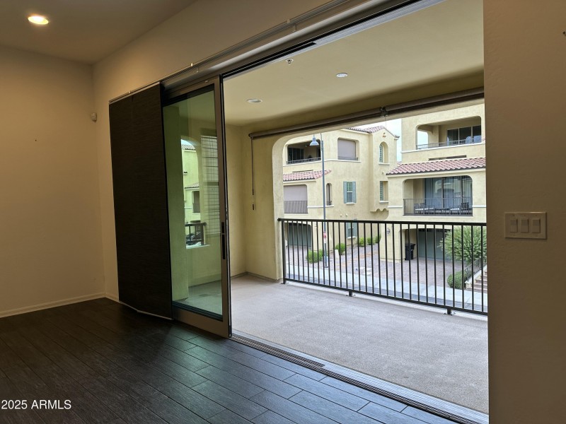 Kitchen glass wall open to large balcony
