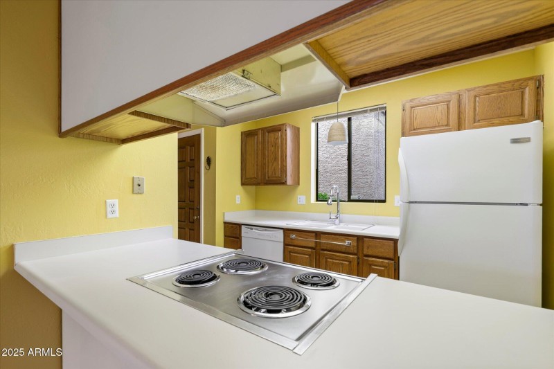 Kitchen from dining area in great room