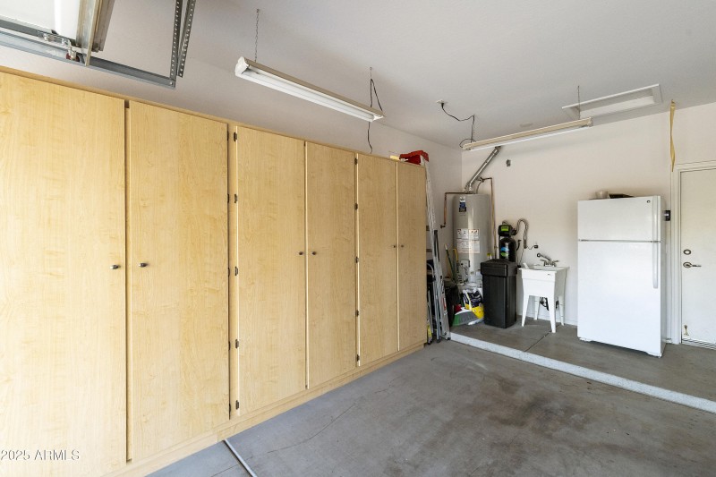 Garage with builty in cabinets and sink