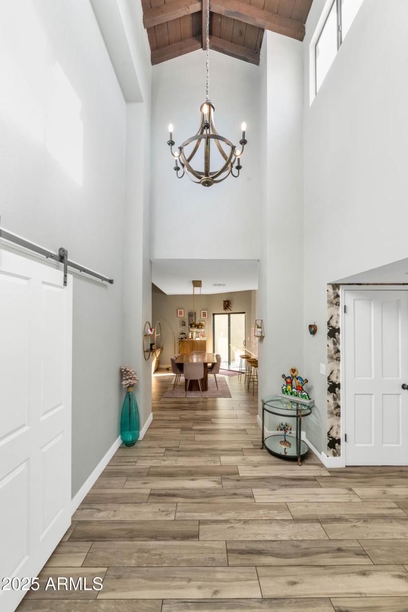 Grand Entry With Wood Beam Ceiling