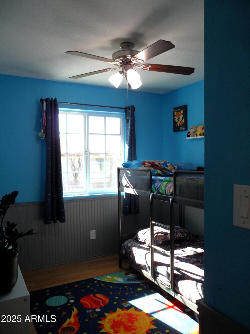 another secondary bedroom with wainscoti