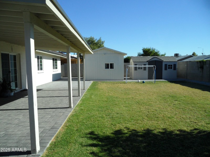 spacious backyard with beautiful pavers