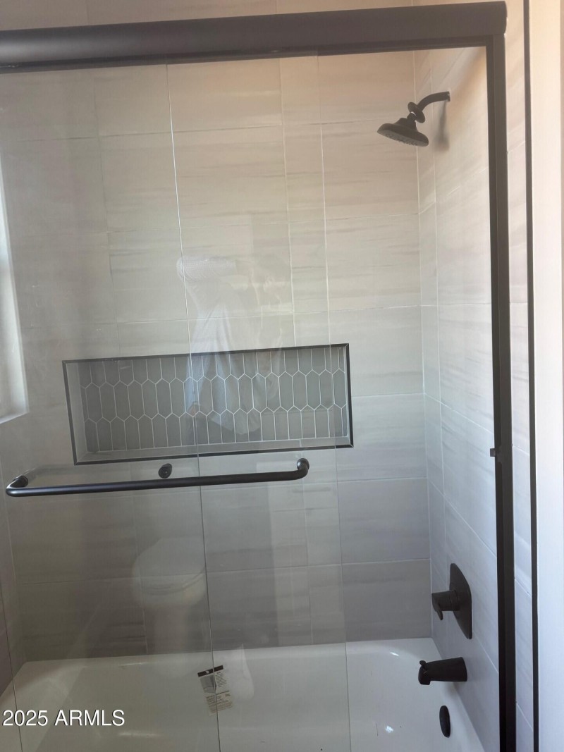 28304 showing off guest bath tile work