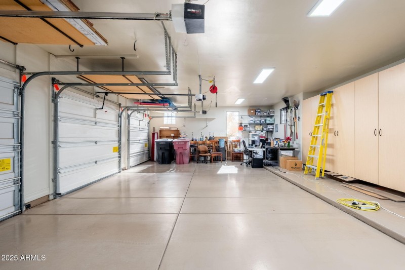 3 Car Garage w tons of storage cabinets