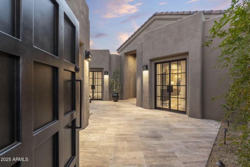 Gated Courtyard to Guesthouse on Left