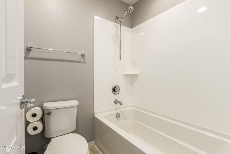 Tub and toilet in upstairs bathroom