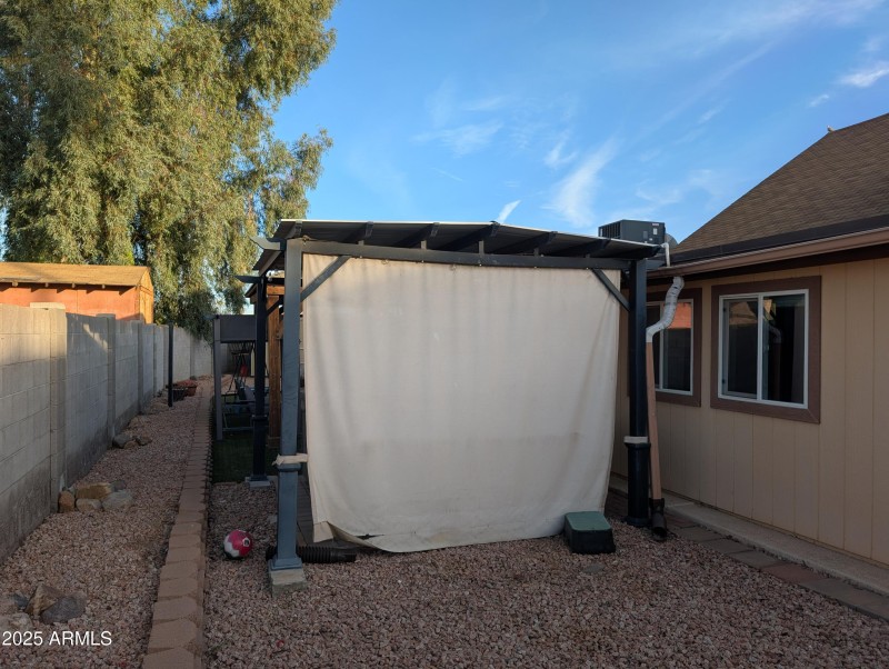 Behind Covered Spa in Backyard