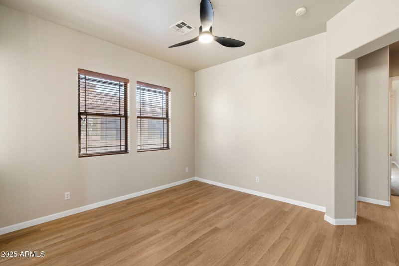 Great room with new flooring and fan