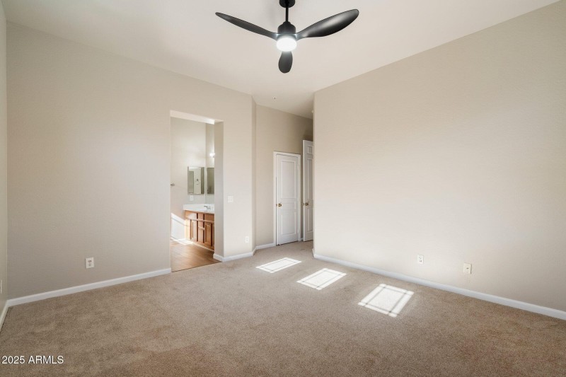 Walk in closet primary bedroom
