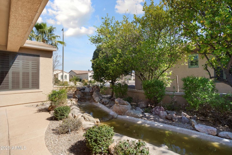 Stream from waterfall towards pond