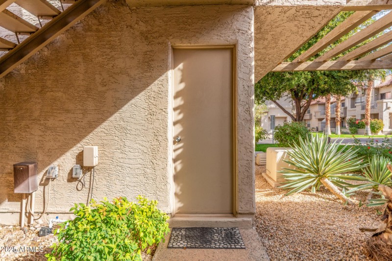 Door to garage across from unit