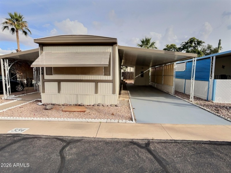 Front Exterior and Covered Carport