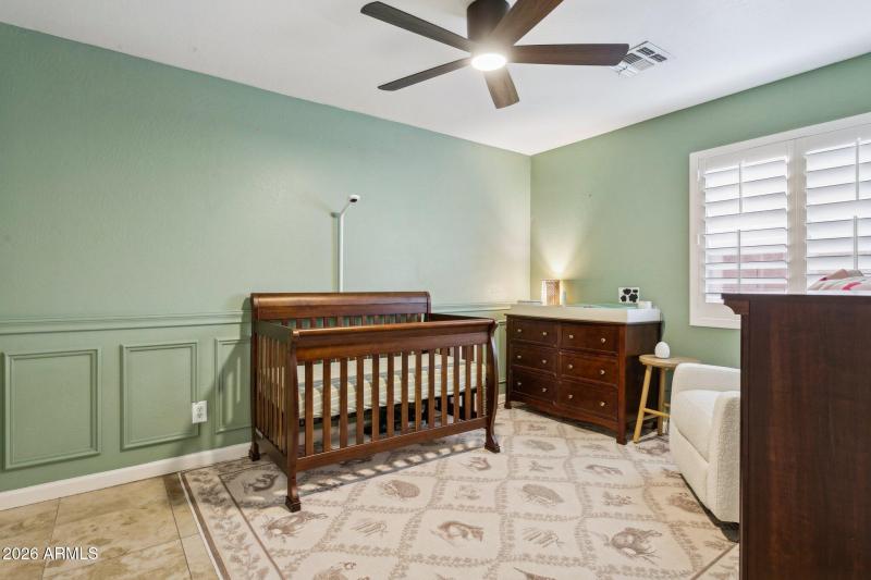 Second bedroom w detailed paneling