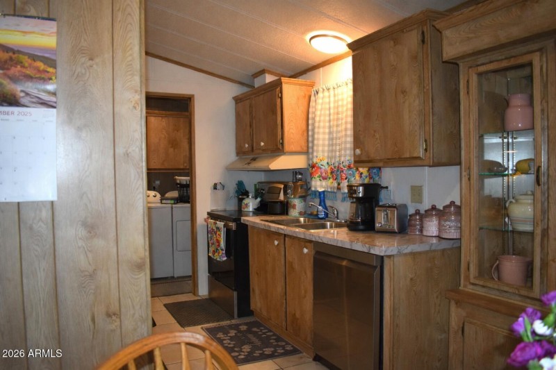 Cozy kitchen extending into the laundry